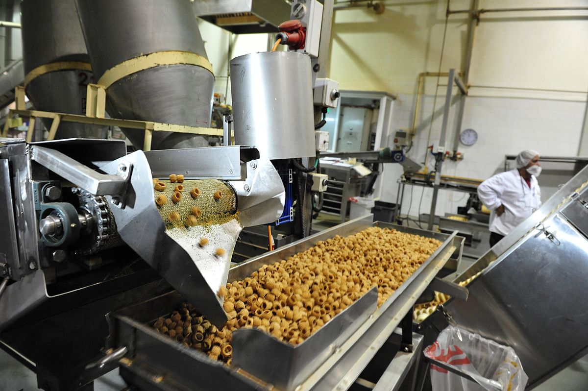 Stainless food processing equipment on a production floor
